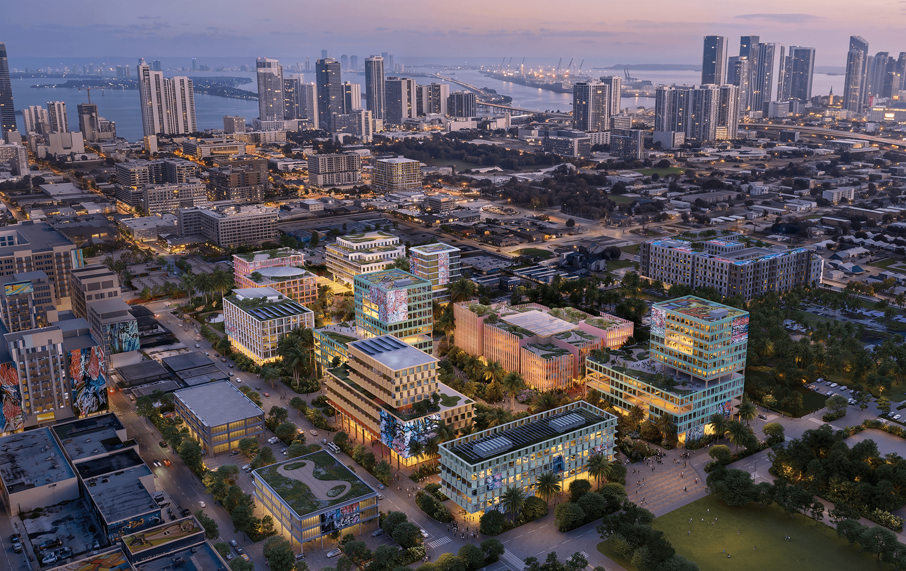 Rendering of CMU Miami aerial view at dusk of a modern waterfront city, with illuminated glass buildings, tree-lined streets, and high-rise towers beneath a pink-blue sky.
